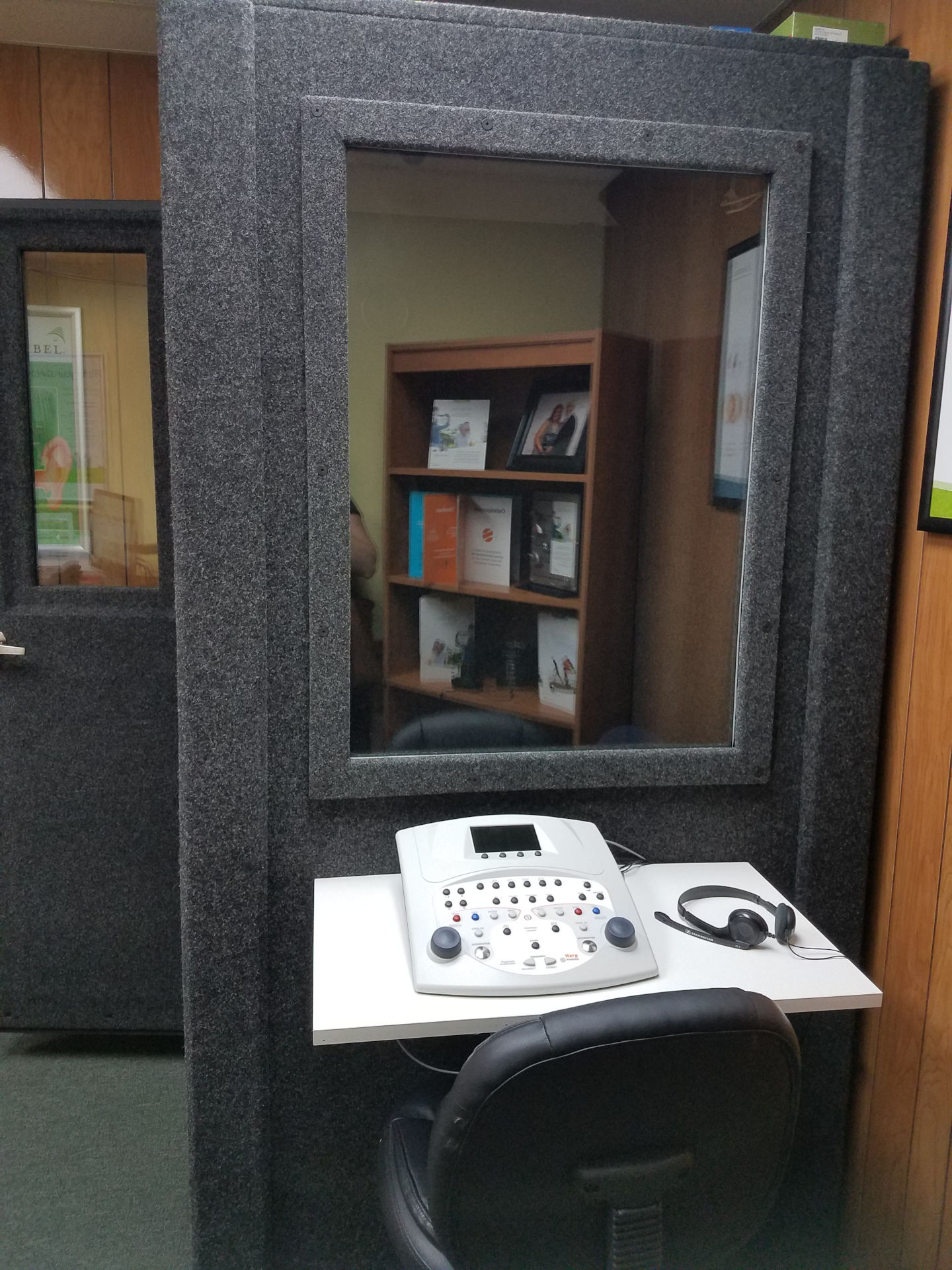 Outside audio booth with equipment on table