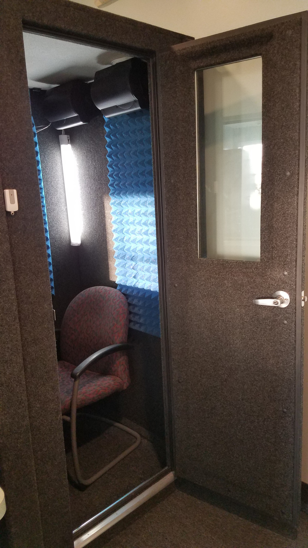 audio booth with chair inside